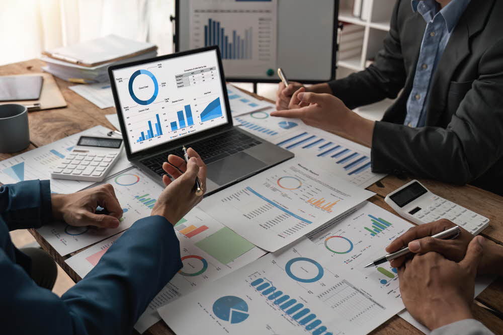 Business team working startup growth of the company and discussion analyzing for financial strategy statistics with computer, documents graph data results of collaboration their successful teamwork. S